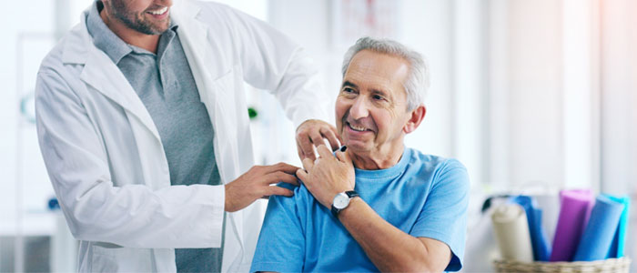 dr with hand on patients shoulder